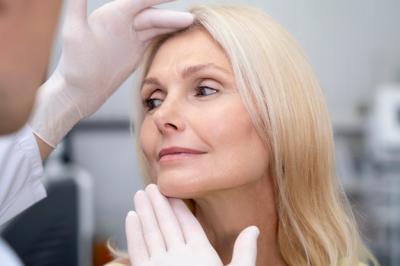 close-up-doctor-checking-woman_23-2149103558.jpg